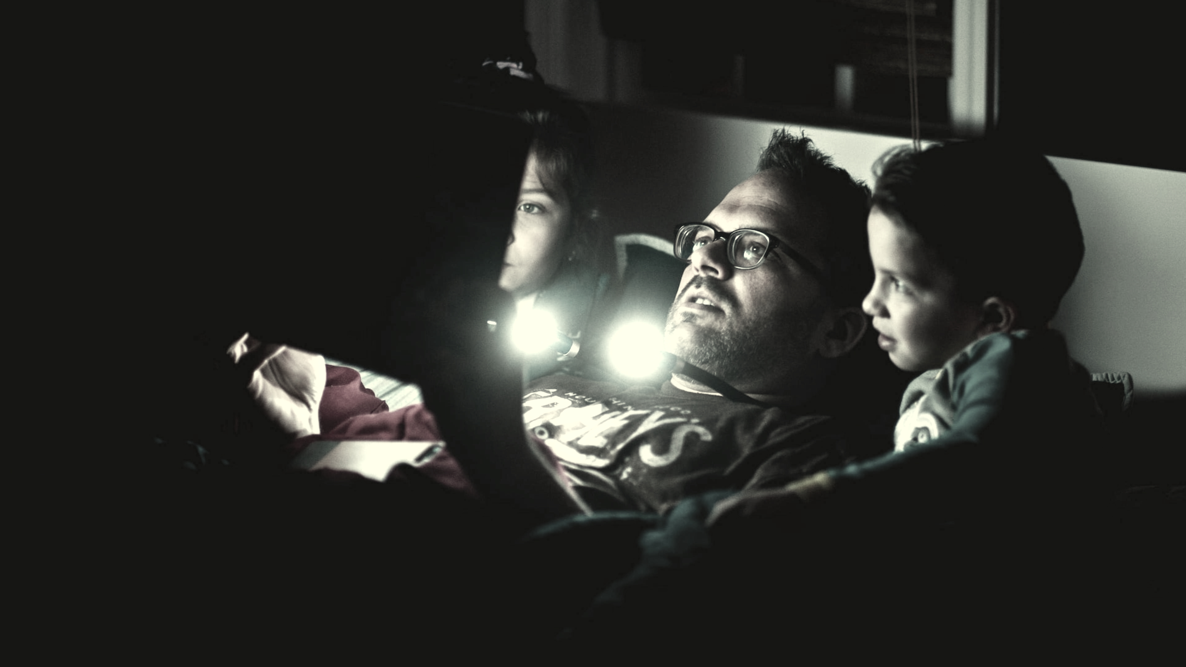 parent reading to their child before bed